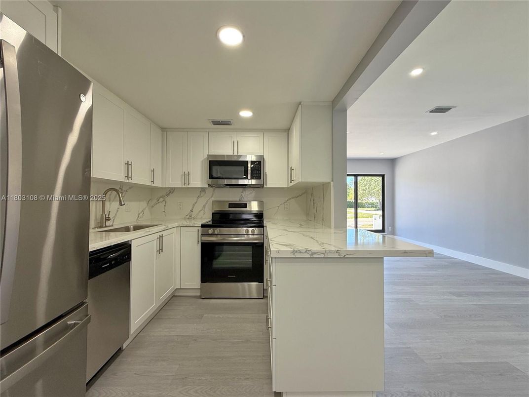 Interior, Kitchen, Recessed Lighting, Stainless Steel Appliances, Wood Texture Flooring