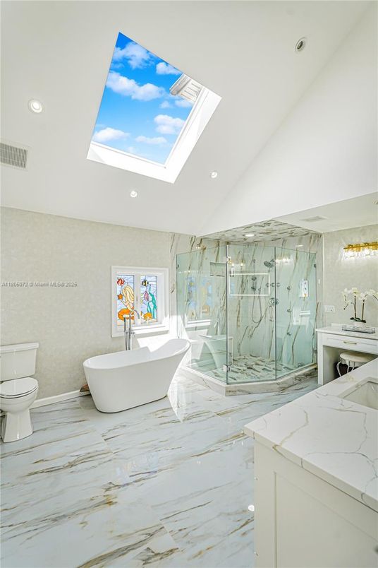 Bathroom, Free Standing Baths, Glass Shower, Interior, Marble, Marble Walls, Recessed Lighting