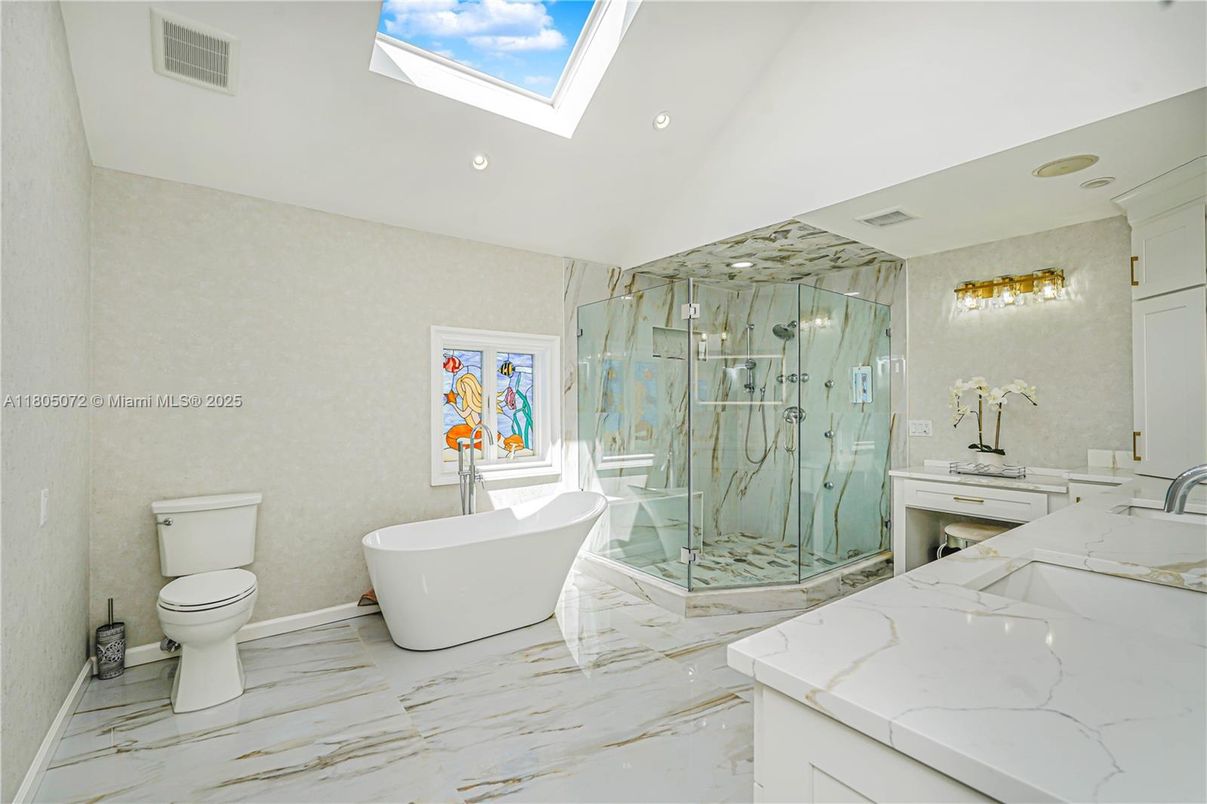Bathroom, Dual Sink Vanities, Free Standing Baths, Glass Shower, Interior, Marble, Marble Walls, Recessed Lighting