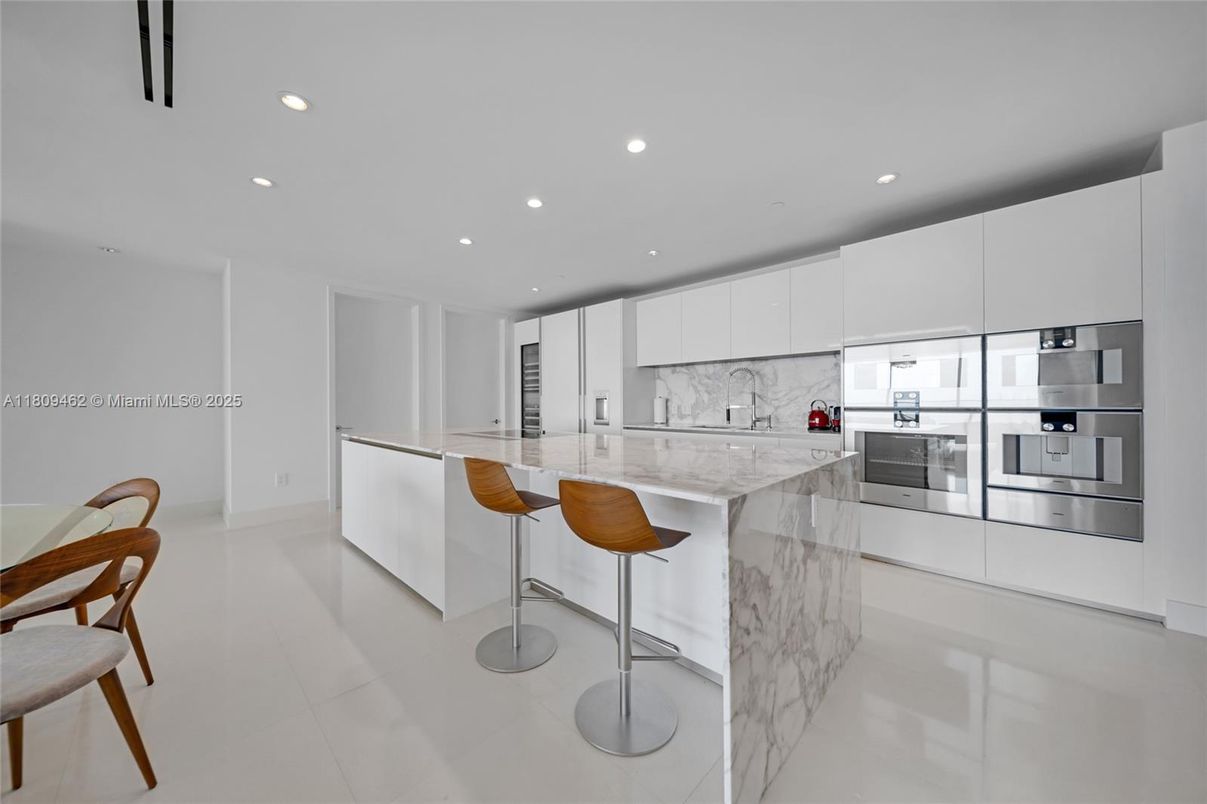 Interior, Kitchen, Marble Walls, Recessed Lighting, Stainless Steel Appliances