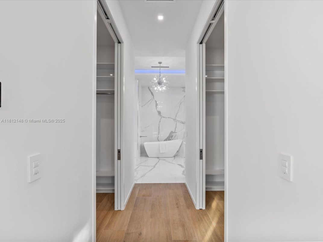 Chandelier, Interior, Marble, Marble Walls, Recessed Lighting, Wood Texture Flooring