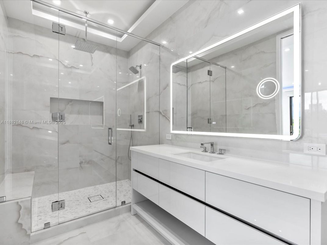 Bathroom, Dual Sink Vanities, Glass Shower, Interior, Marble Walls, Recessed Lighting