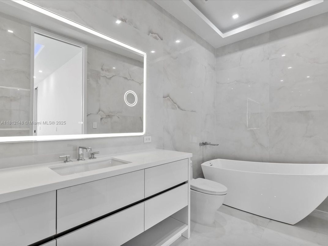 Bathroom, Dual Sink Vanities, Free Standing Baths, Interior, Marble Walls, Recessed Lighting