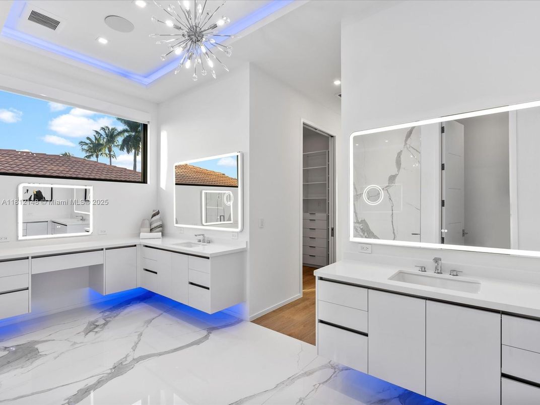 Bathroom, Dual Sink Vanities, Interior, Marble, Pendant Lights, Recessed Lighting, Wood Texture Flooring