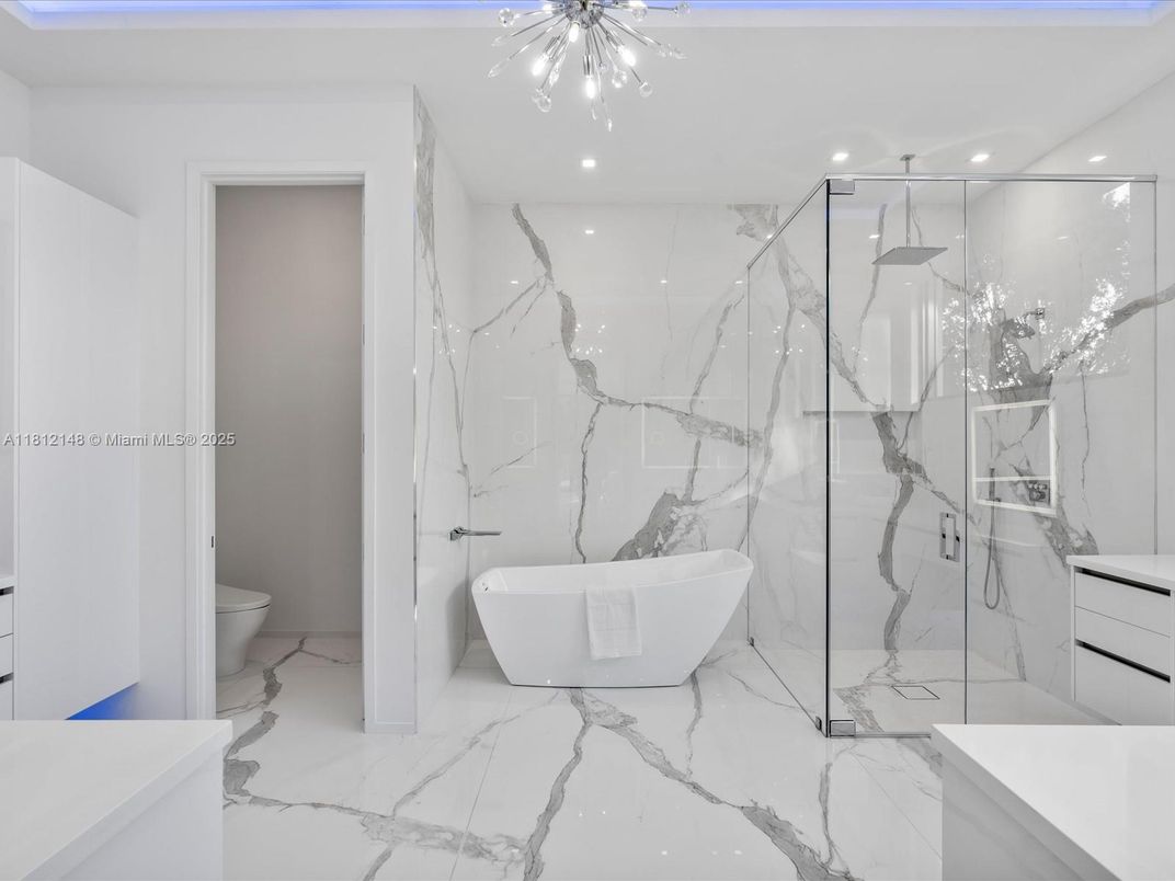 Bathroom, Free Standing Baths, Glass Shower, Interior, Marble, Marble Walls, Recessed Lighting