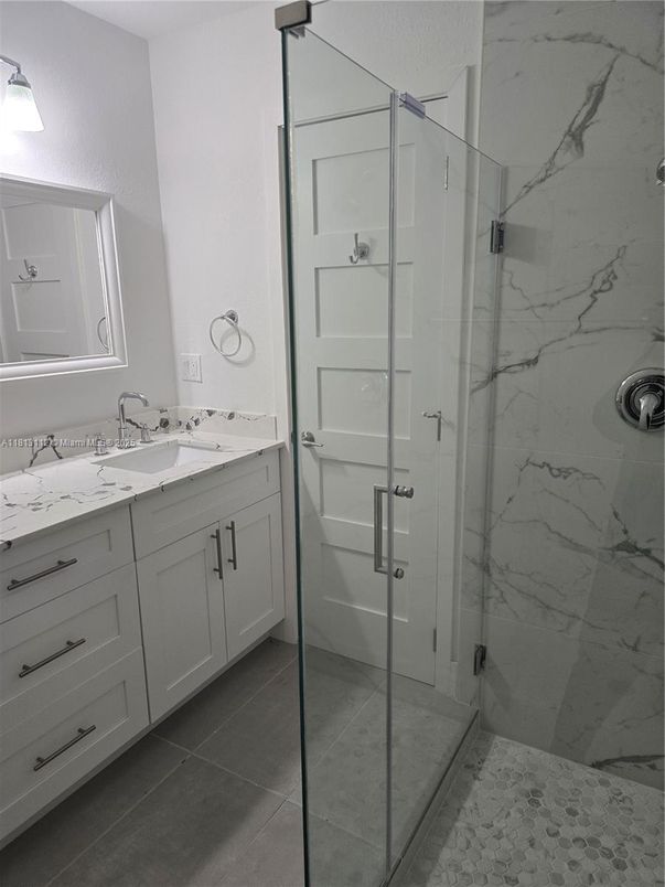 Bathroom, Dual Sink Vanities, Glass Shower, Interior, Marble Walls