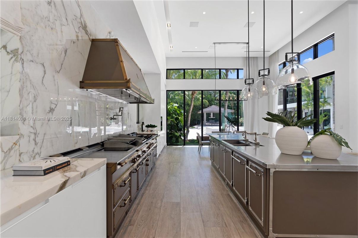 Interior, Kitchen, Marble Walls, Pendant Lights, Recessed Lighting, Stainless Steel Appliances, Wood Texture Flooring