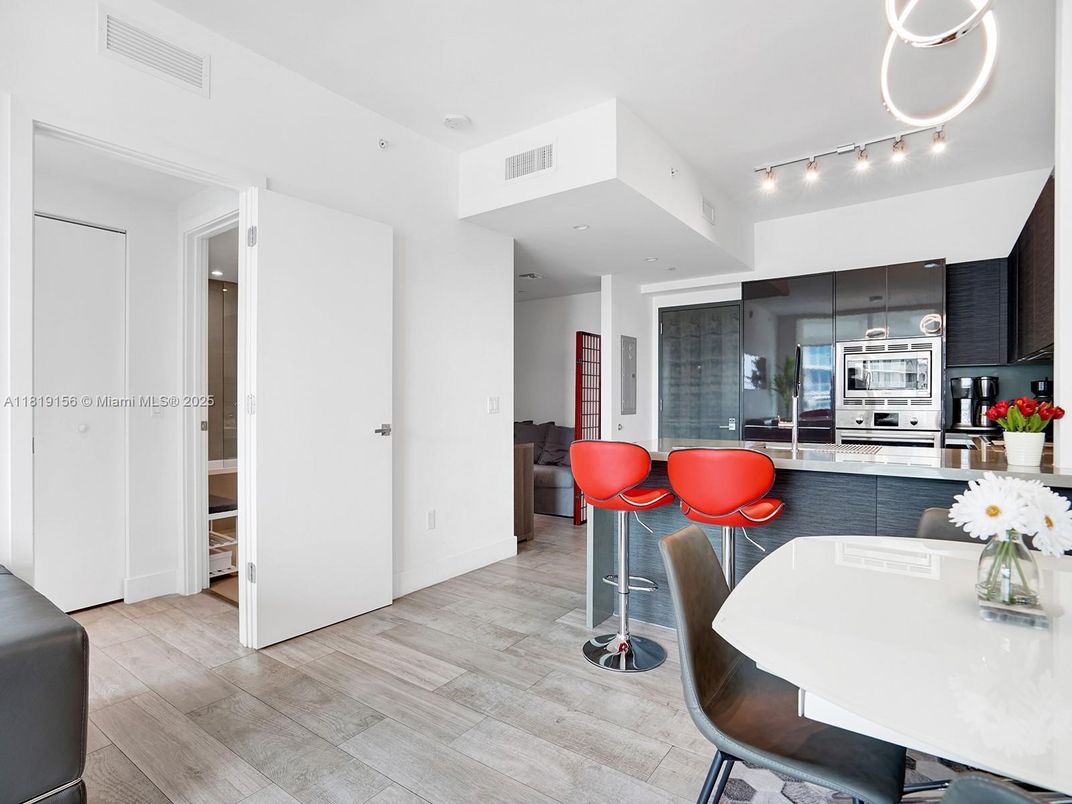 Dining room, Interior, Kitchen, Recessed Lighting, Stainless Steel Appliances, Wood Texture Flooring