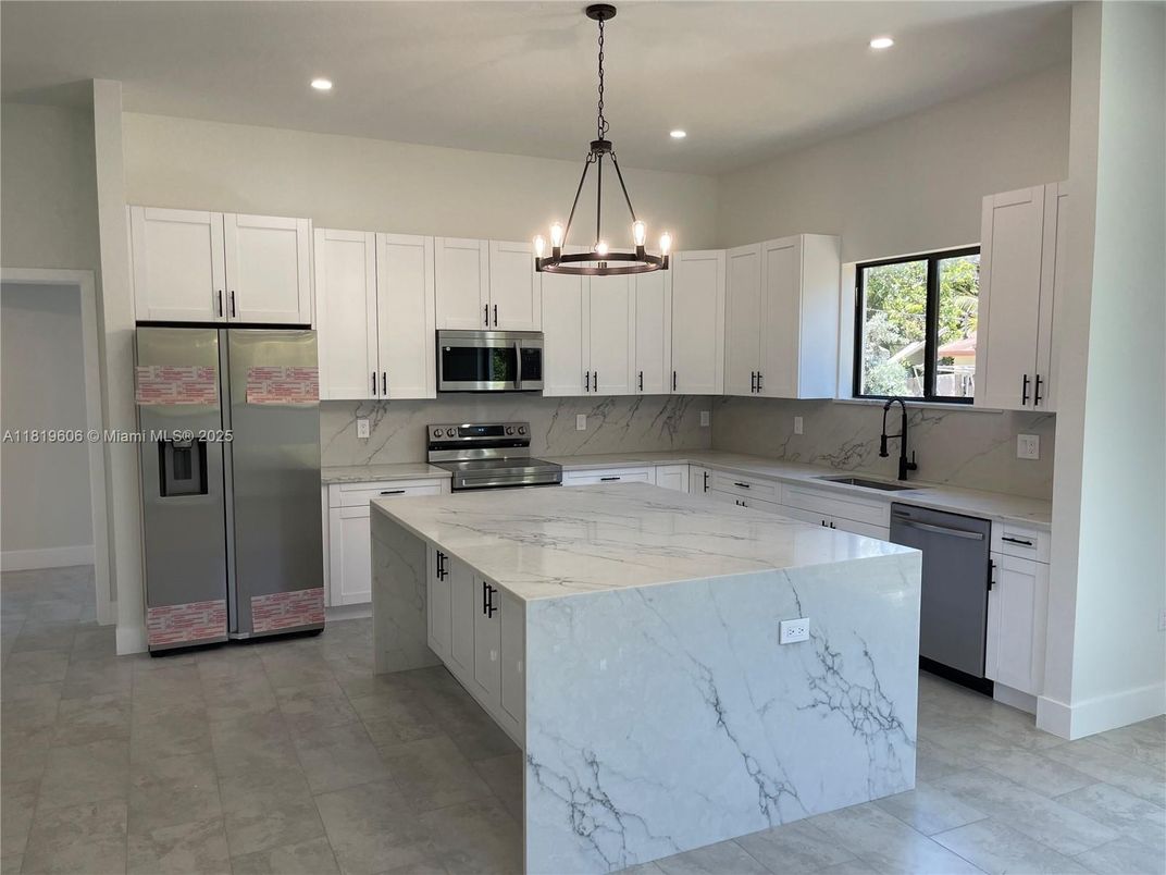 Interior, Kitchen, Marble Walls, Pendant Lights, Recessed Lighting, Stainless Steel Appliances