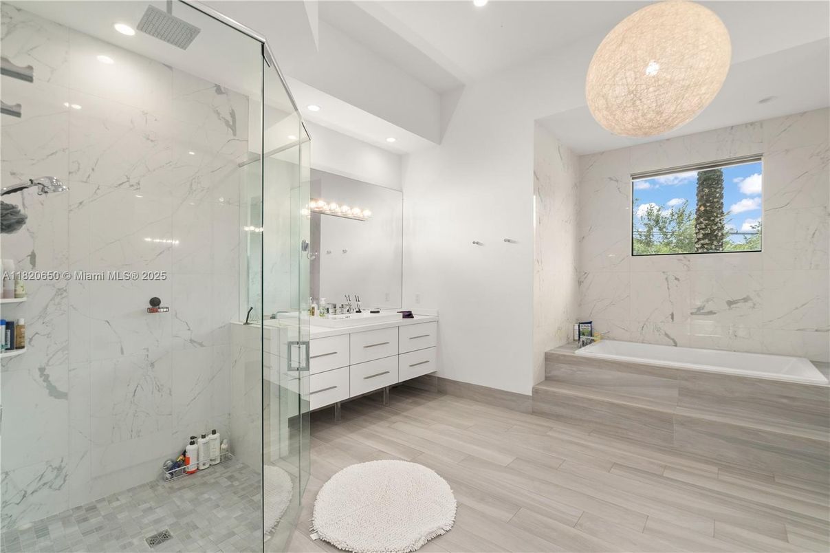 Bathroom, Glass Shower, Interior, Marble Walls, Pendant Lights, Recessed Lighting, Wood Texture Flooring