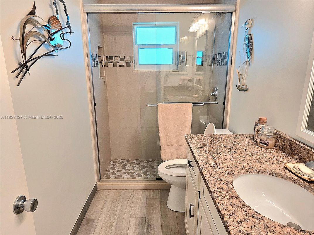 Bathroom, Dual Sink Vanities, Glass Shower, Interior, Wood Texture Flooring