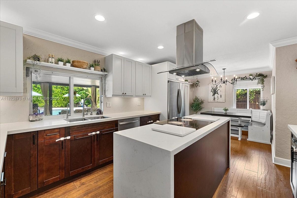 Dining room, Interior, Kitchen, Pendant Lights, Recessed Lighting, Stainless Steel Appliances, Wood Texture Flooring