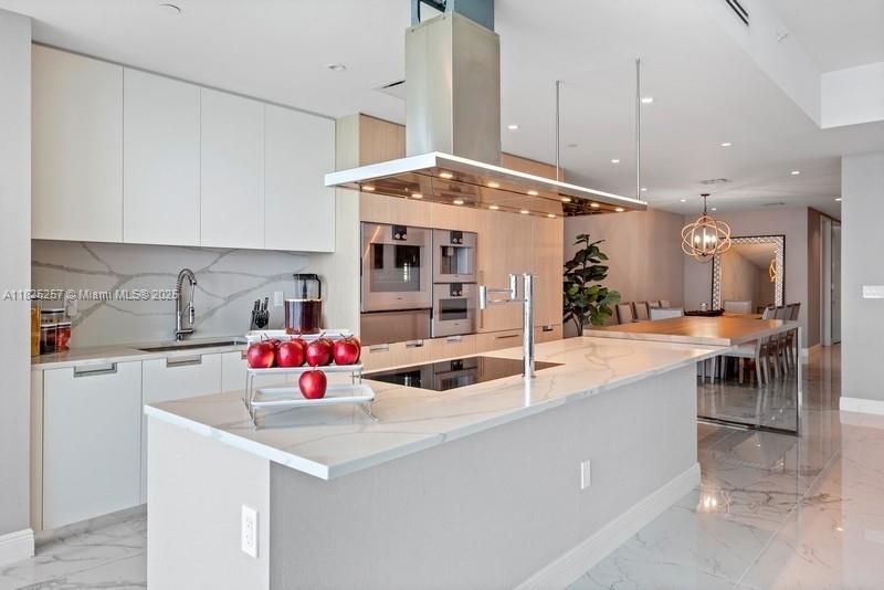 Chandelier, Dining room, Interior, Kitchen, Marble, Pendant Lights, Recessed Lighting, Stainless Steel Appliances