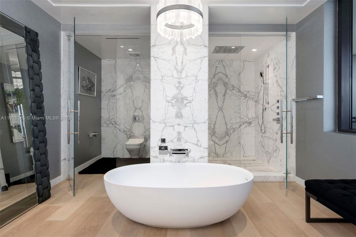 Bathroom, Free Standing Baths, Glass Shower, Interior, Marble Walls, Recessed Lighting, Wood Texture Flooring