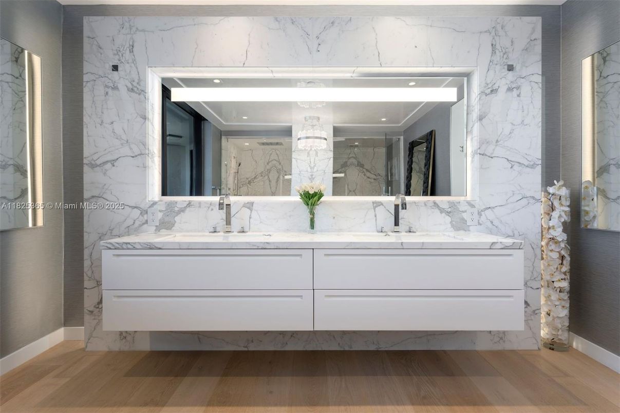 Bathroom, Dual Sink Vanities, Interior, Marble Walls, Recessed Lighting, Wood Texture Flooring