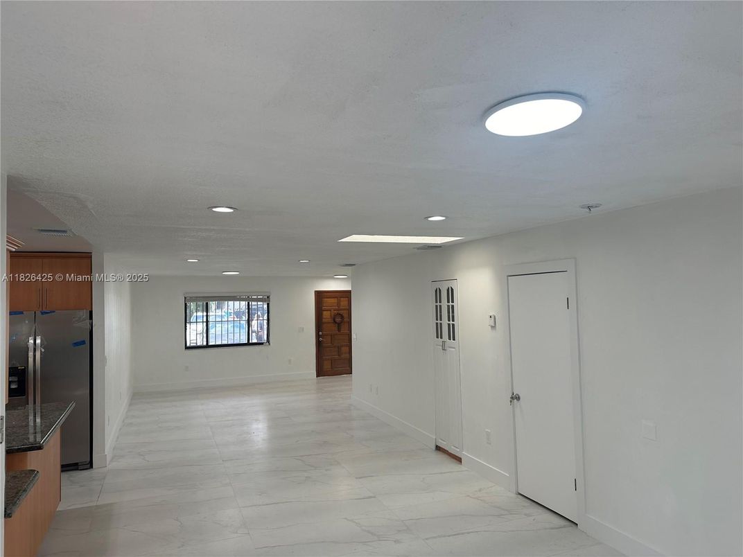 Empty room, Interior, Kitchen, Marble, Recessed Lighting, Stainless Steel Appliances