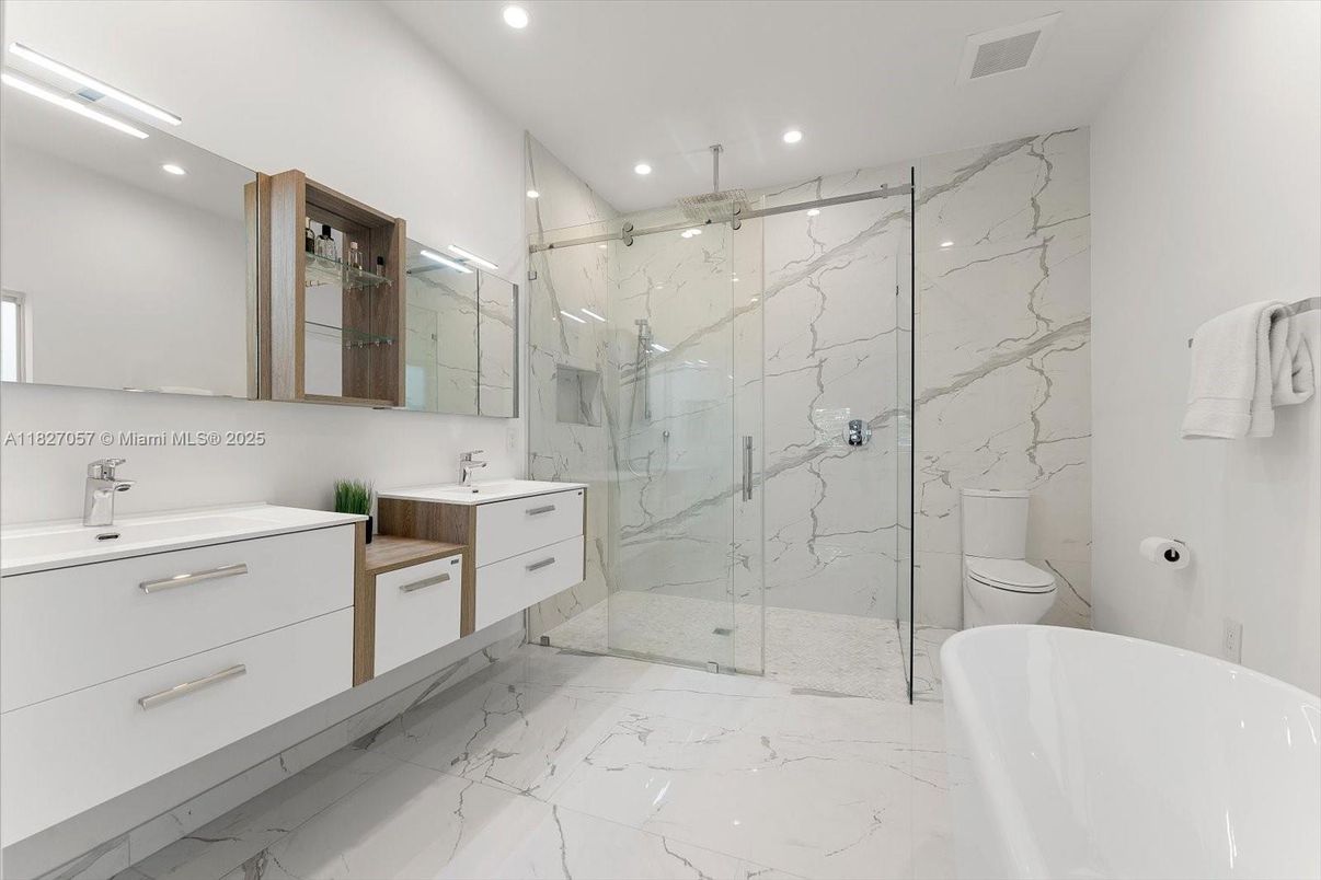 Bathroom, Dual Sink Vanities, Free Standing Baths, Glass Shower, Interior, Marble, Marble Walls, Recessed Lighting