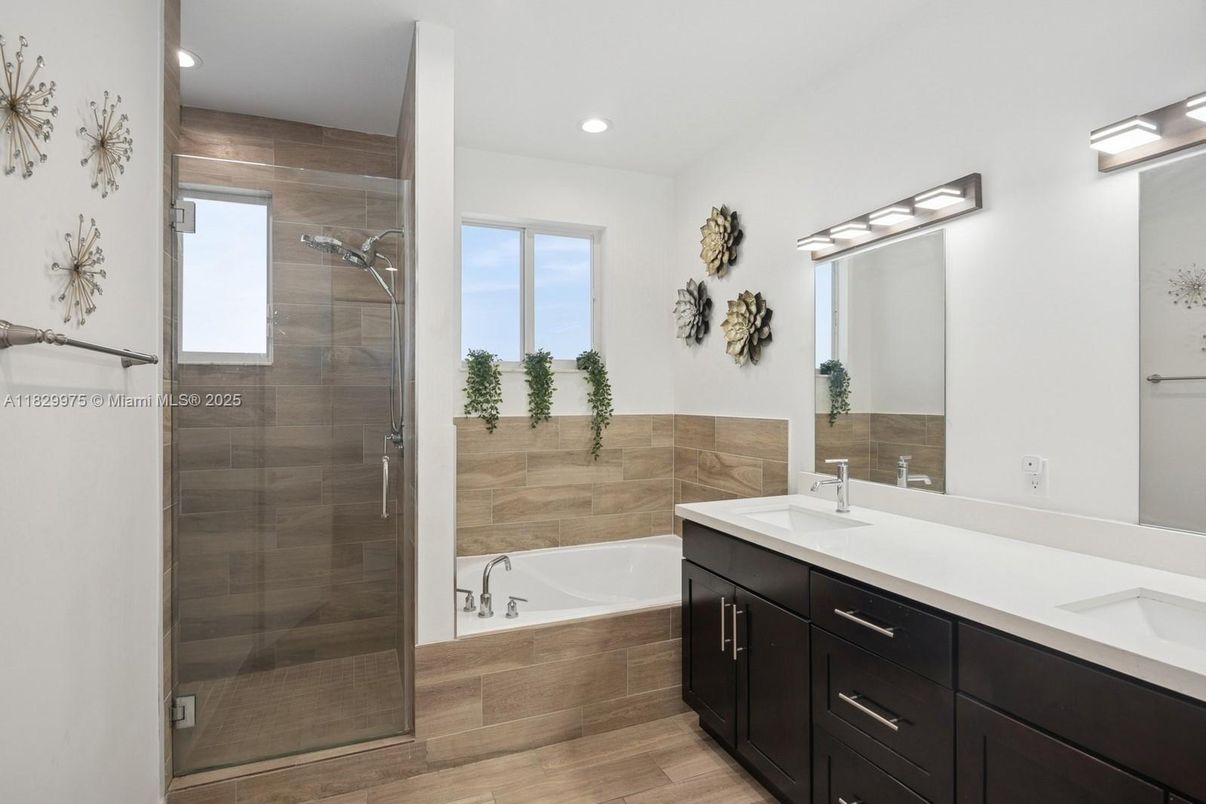Bathroom, Dual Sink Vanities, Glass Shower, Interior, Recessed Lighting, Wood Texture Flooring