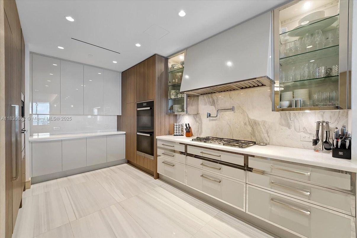 Interior, Kitchen, Marble Walls, Recessed Lighting, Stainless Steel Appliances