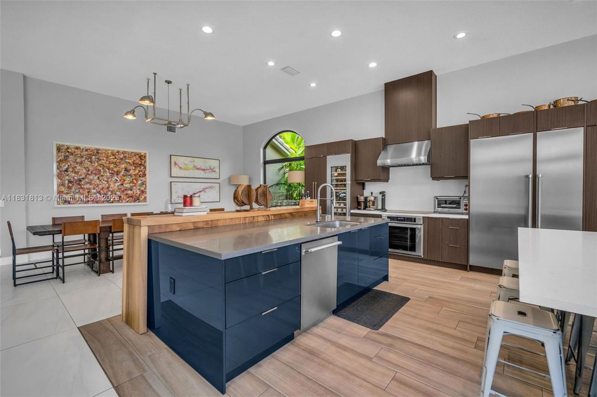 Dining room, Interior, Kitchen, Pendant Lights, Recessed Lighting, Stainless Steel Appliances, Wood Texture Flooring