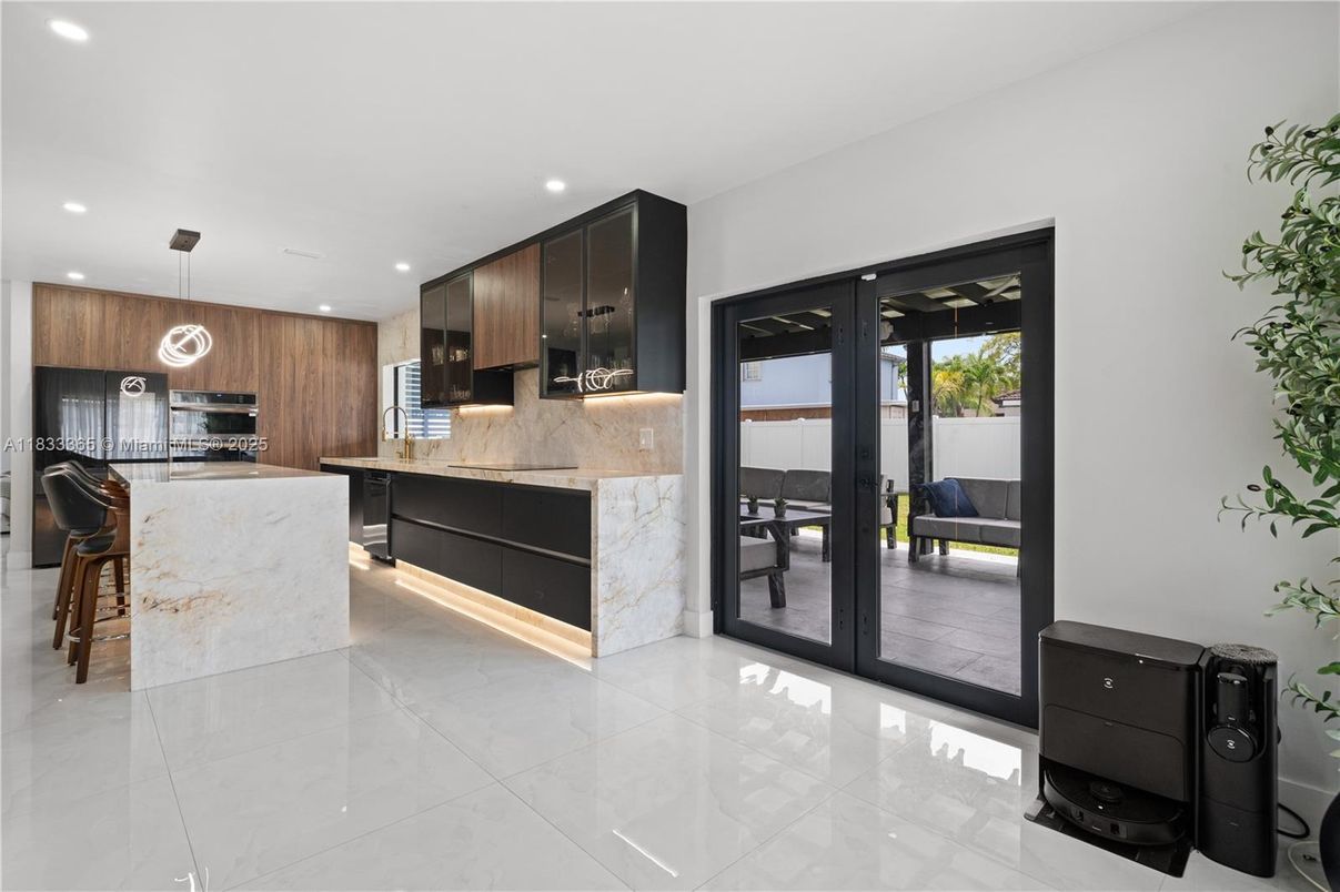 Interior, Kitchen, Marble Walls, Pendant Lights, Recessed Lighting, Stainless Steel Appliances