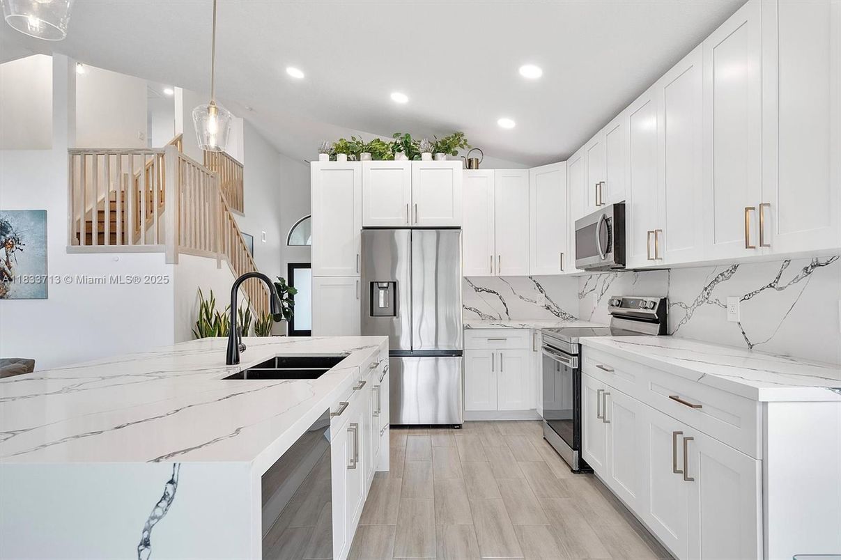 Interior, Kitchen, Marble Walls, Pendant Lights, Recessed Lighting, Stainless Steel Appliances, Wood Texture Flooring