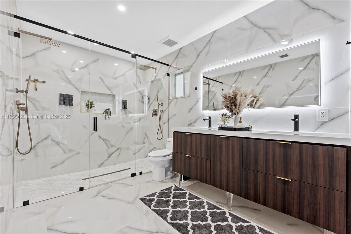 Bathroom, Dual Sink Vanities, Glass Shower, Interior, Marble, Marble Walls, Recessed Lighting