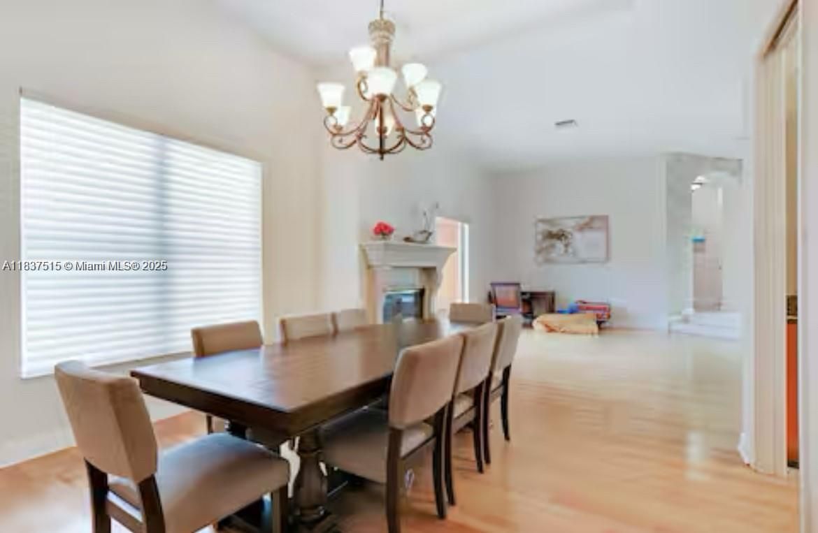 Chandelier, Dining room, Fireplace, Interior, Wood Texture Flooring