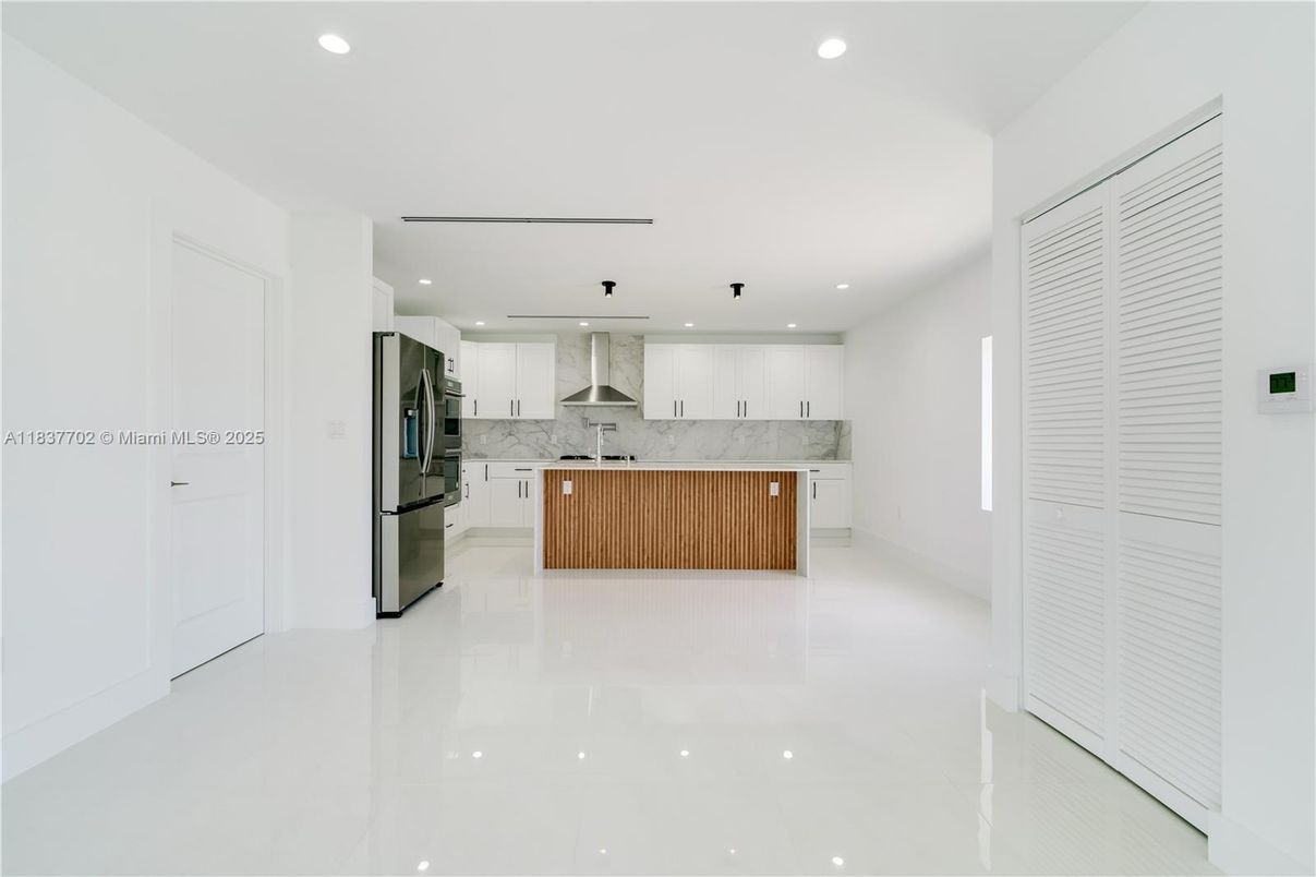 Interior, Kitchen, Marble Walls, Recessed Lighting, Stainless Steel Appliances
