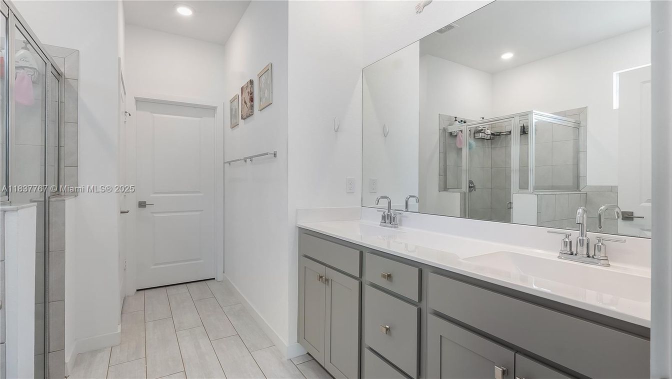 Bathroom, Dual Sink Vanities, Glass Shower, Interior, Recessed Lighting, Wood Texture Flooring