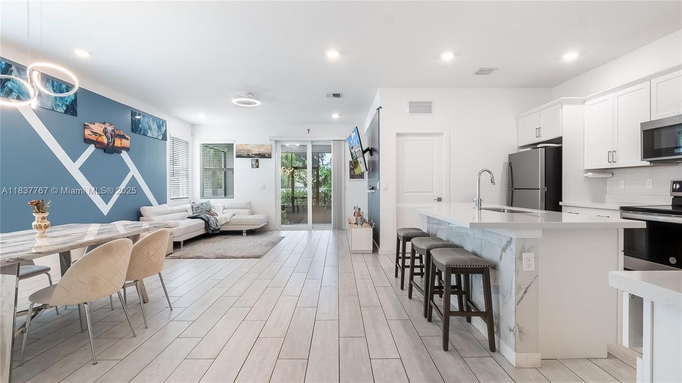 Dining room, Interior, Kitchen, Living room, Pendant Lights, Recessed Lighting, Stainless Steel Appliances, Wood Texture Flooring