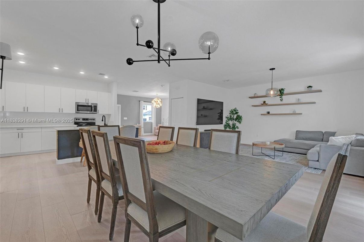 Dining room, Interior, Kitchen, Living room, Pendant Lights, Recessed Lighting, Stainless Steel Appliances, Wood Texture Flooring
