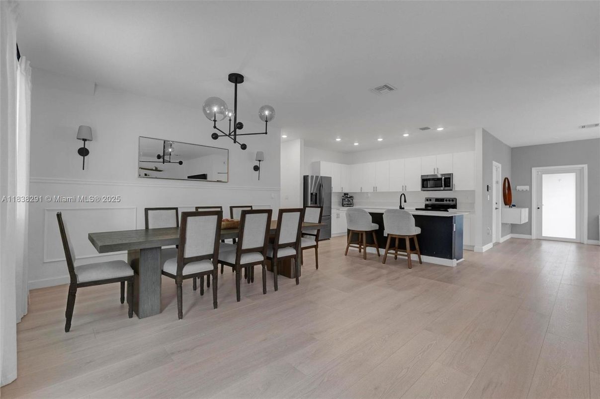 Dining room, Interior, Kitchen, Pendant Lights, Recessed Lighting, Stainless Steel Appliances, Wood Texture Flooring