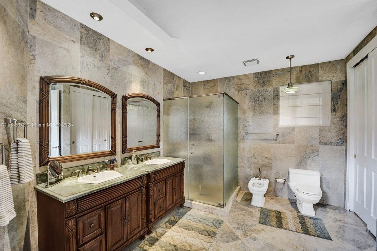 Bathroom, Dual Sink Vanities, Glass Shower, Interior, Pendant Lights, Recessed Lighting, Stone Walls