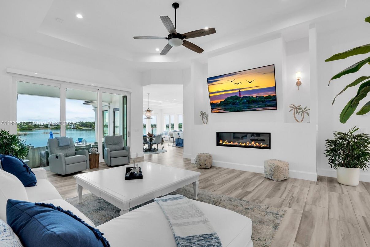 Fireplace, Interior, Living room, Pendant Lights, Recessed Lighting, Water, Wood Texture Flooring