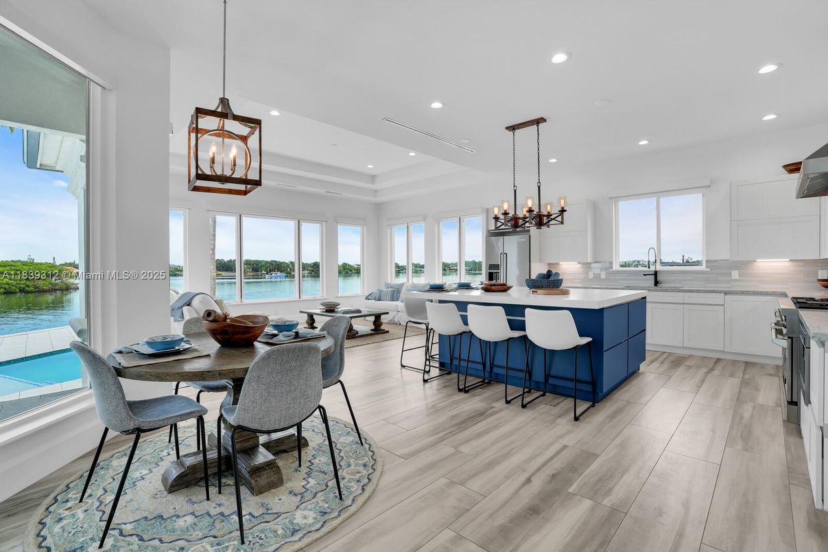 Chandelier, Dining room, Interior, Kitchen, Pendant Lights, Recessed Lighting, Water, Wood Texture Flooring