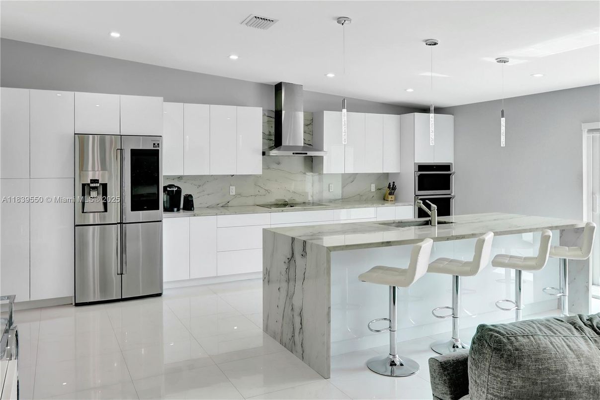 Interior, Kitchen, Marble Walls, Pendant Lights, Recessed Lighting, Stainless Steel Appliances