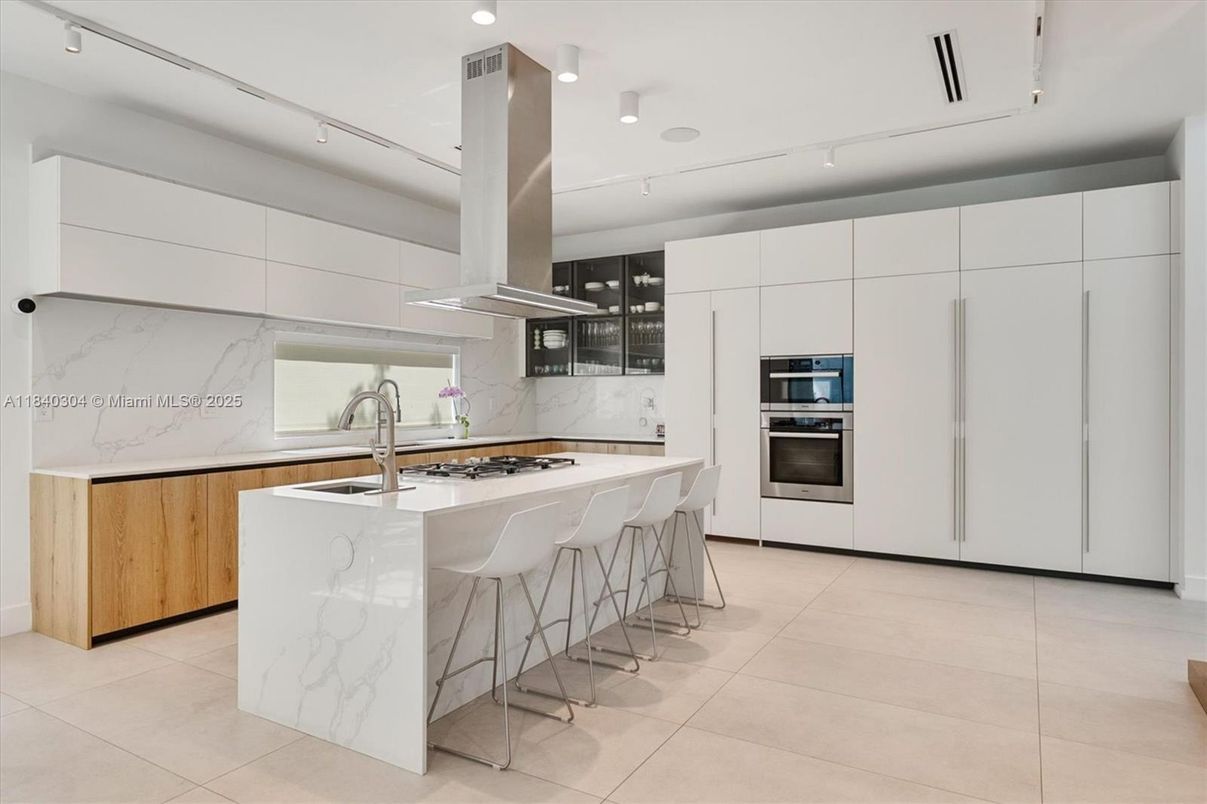 Interior, Kitchen, Marble Walls, Recessed Lighting, Stainless Steel Appliances