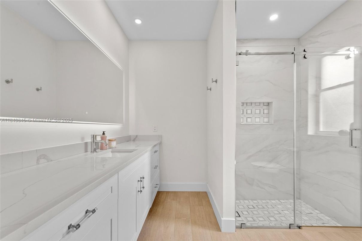 Bathroom, Glass Shower, Interior, Marble Walls, Recessed Lighting, Wood Texture Flooring