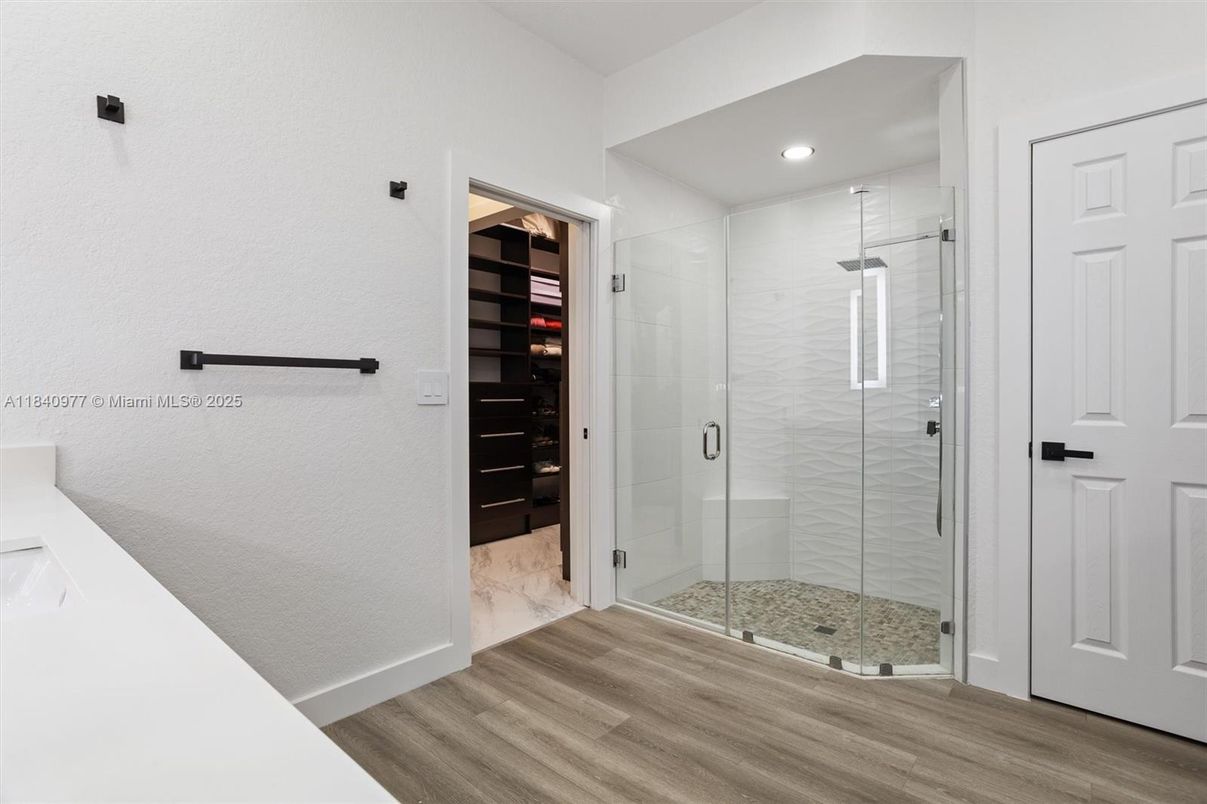 Bathroom, Glass Shower, Interior, Recessed Lighting, Walk-in Closets, Wood Texture Flooring