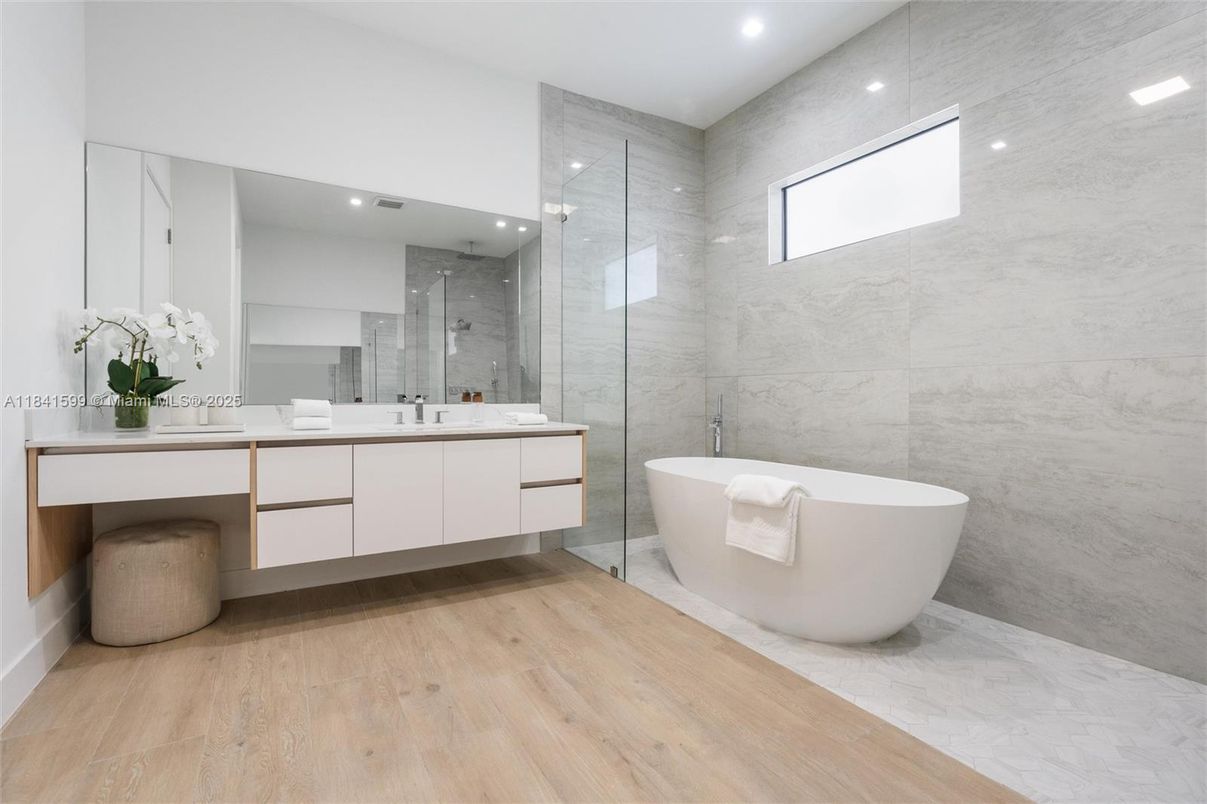 Bathroom, Free Standing Baths, Glass Shower, Interior, Marble Walls, Recessed Lighting, Wood Texture Flooring