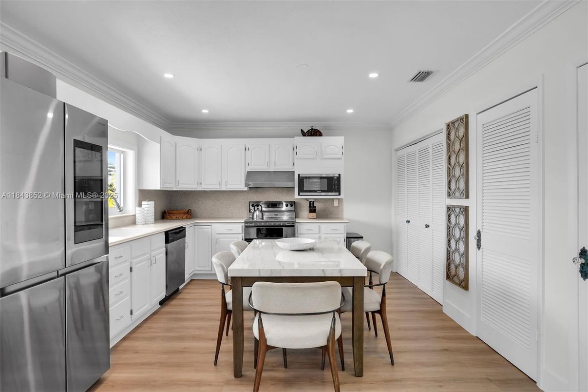 Dining room, Interior, Kitchen, Recessed Lighting, Stainless Steel Appliances, Wood Texture Flooring
