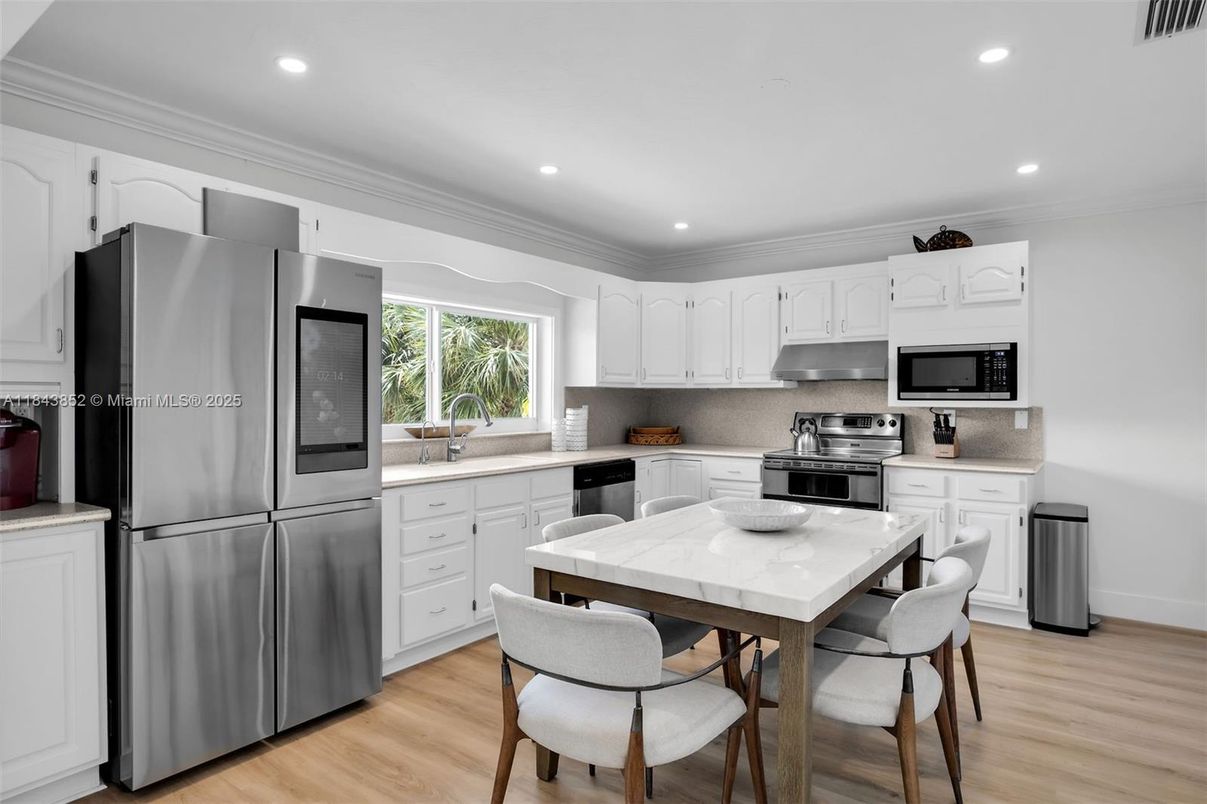 Dining room, Interior, Kitchen, Recessed Lighting, Stainless Steel Appliances, Wood Texture Flooring