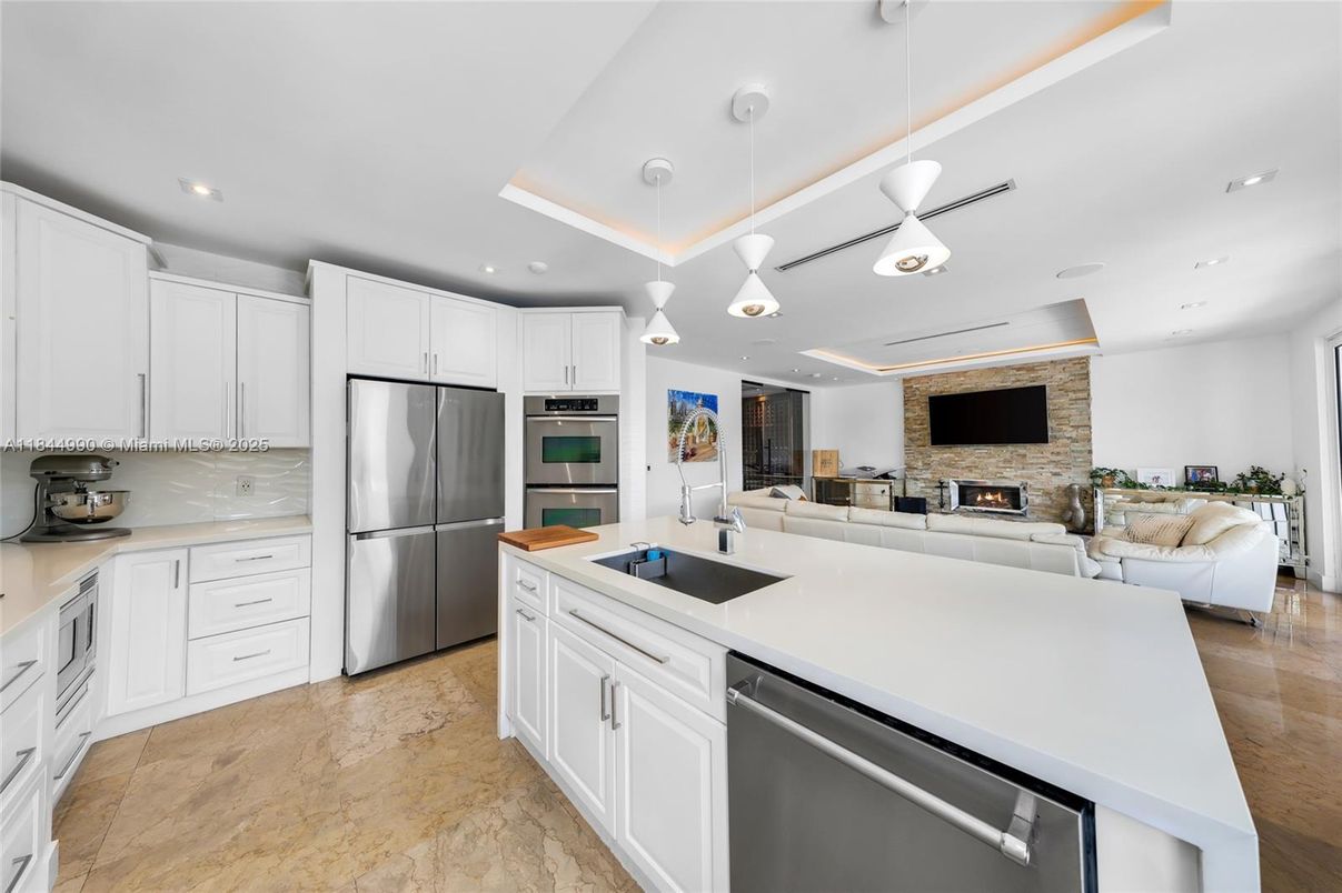 Fireplace, Interior, Kitchen, Living room, Pendant Lights, Recessed Lighting, Stainless Steel Appliances, Stone Walls