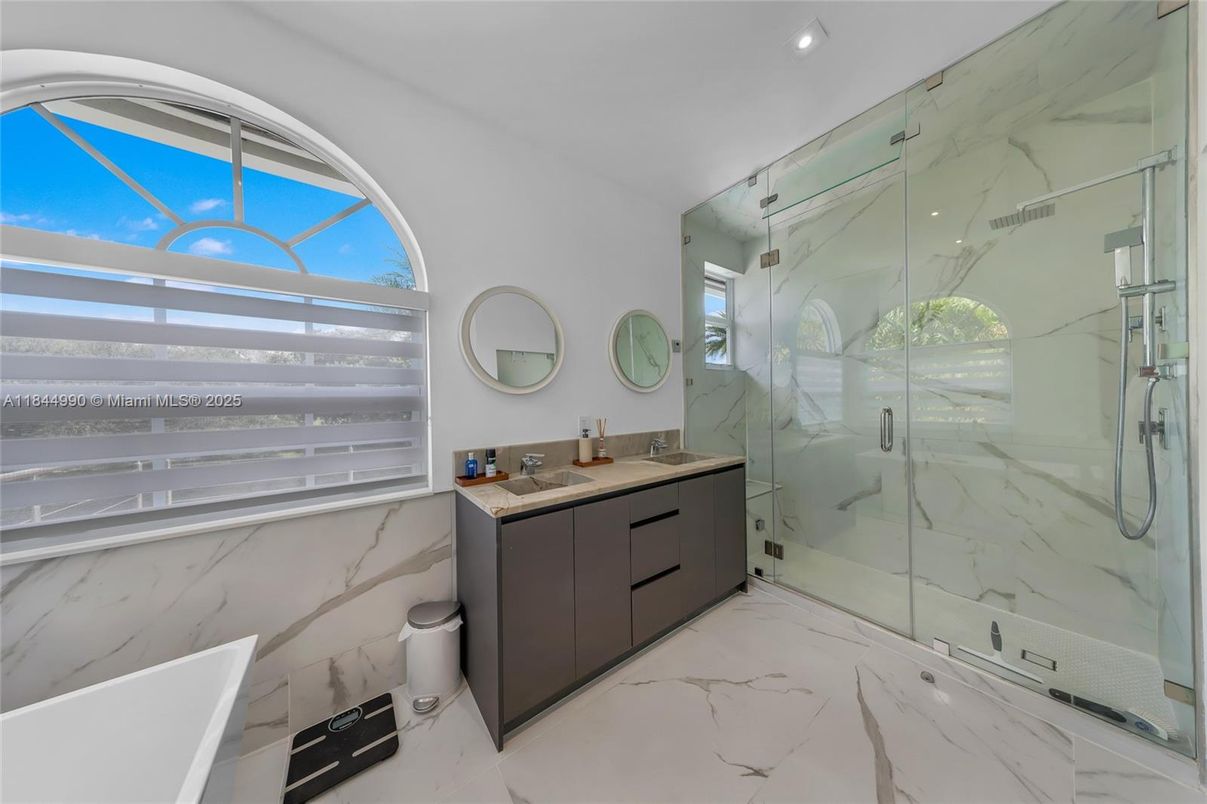 Bathroom, Dual Sink Vanities, Glass Shower, Interior, Marble, Marble Walls, Recessed Lighting