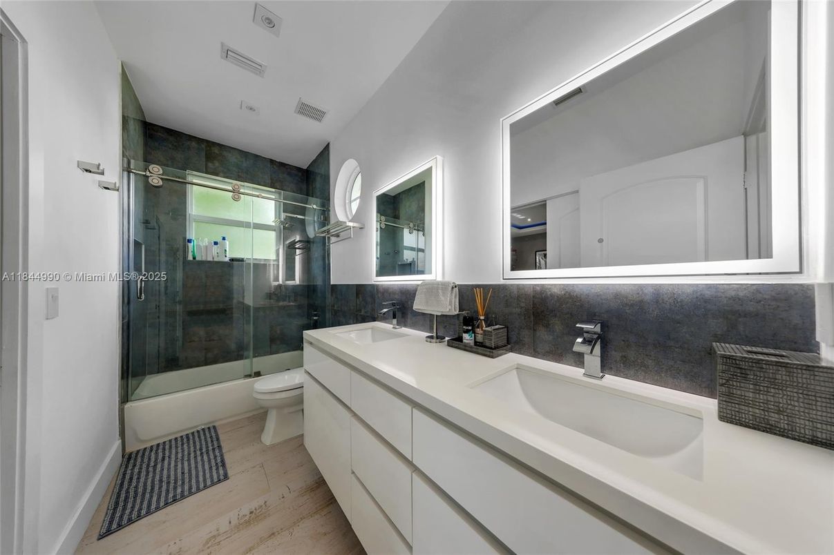 Bathroom, Dual Sink Vanities, Glass Shower, Interior, Wood Texture Flooring