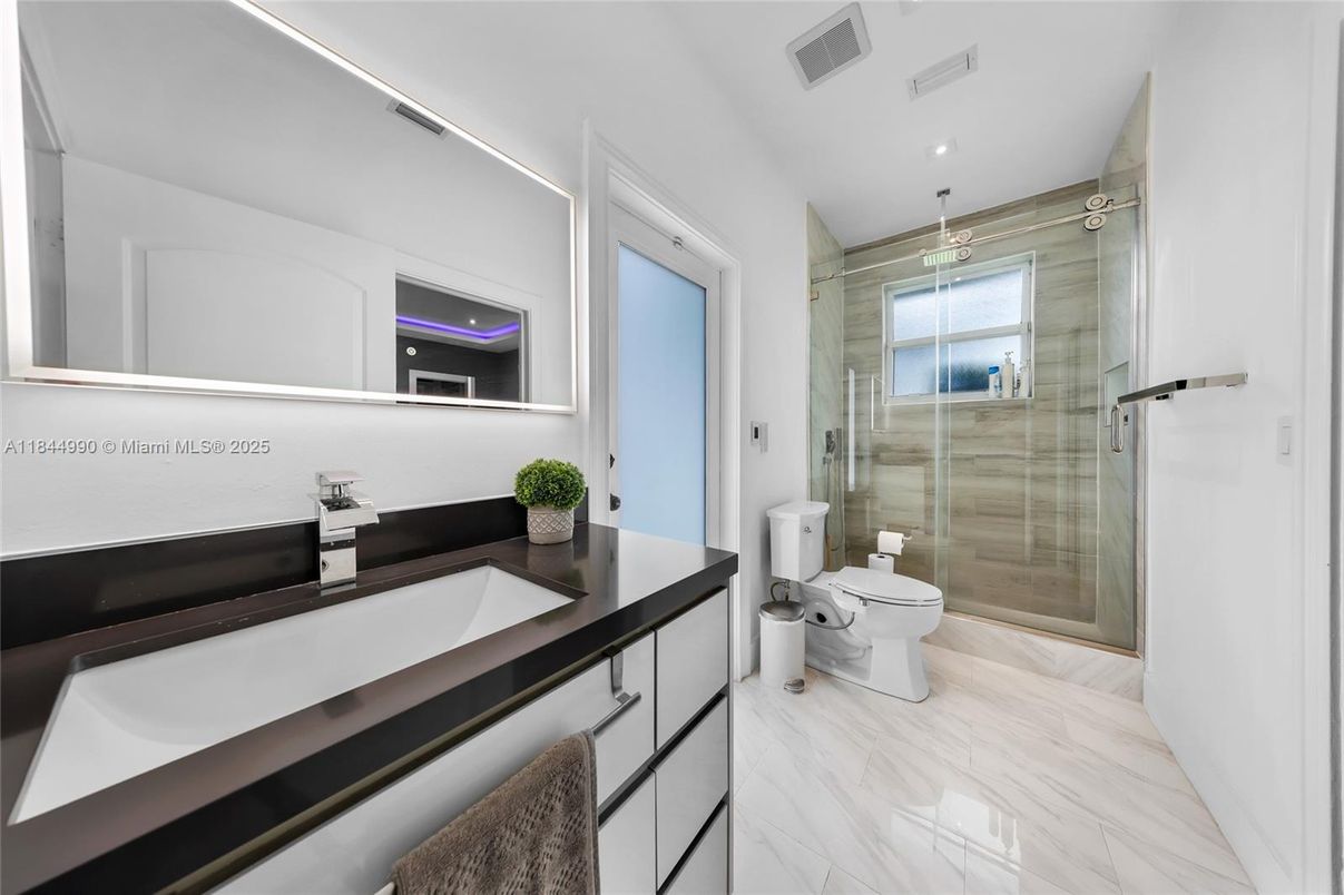 Bathroom, Dual Sink Vanities, Glass Shower, Interior, Marble, Recessed Lighting
