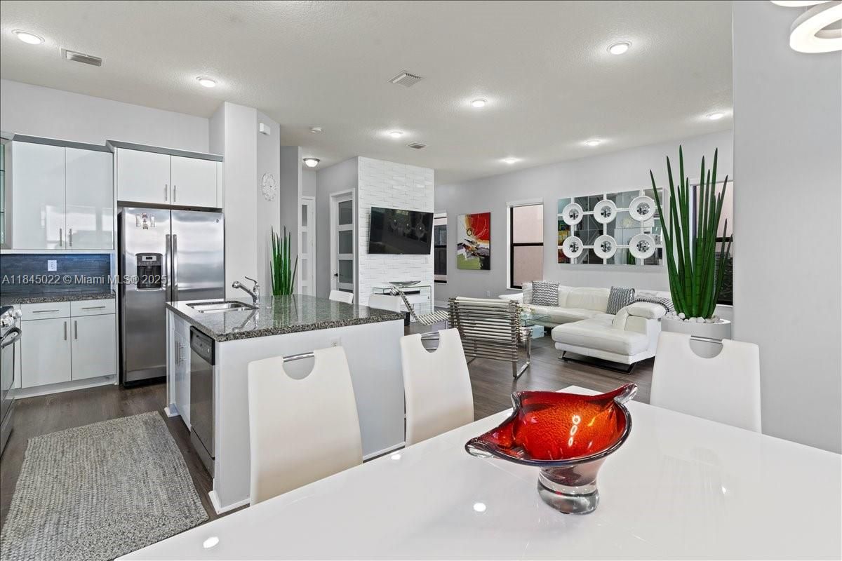 Dining room, Interior, Kitchen, Living room, Recessed Lighting, Stainless Steel Appliances, Wood Texture Flooring