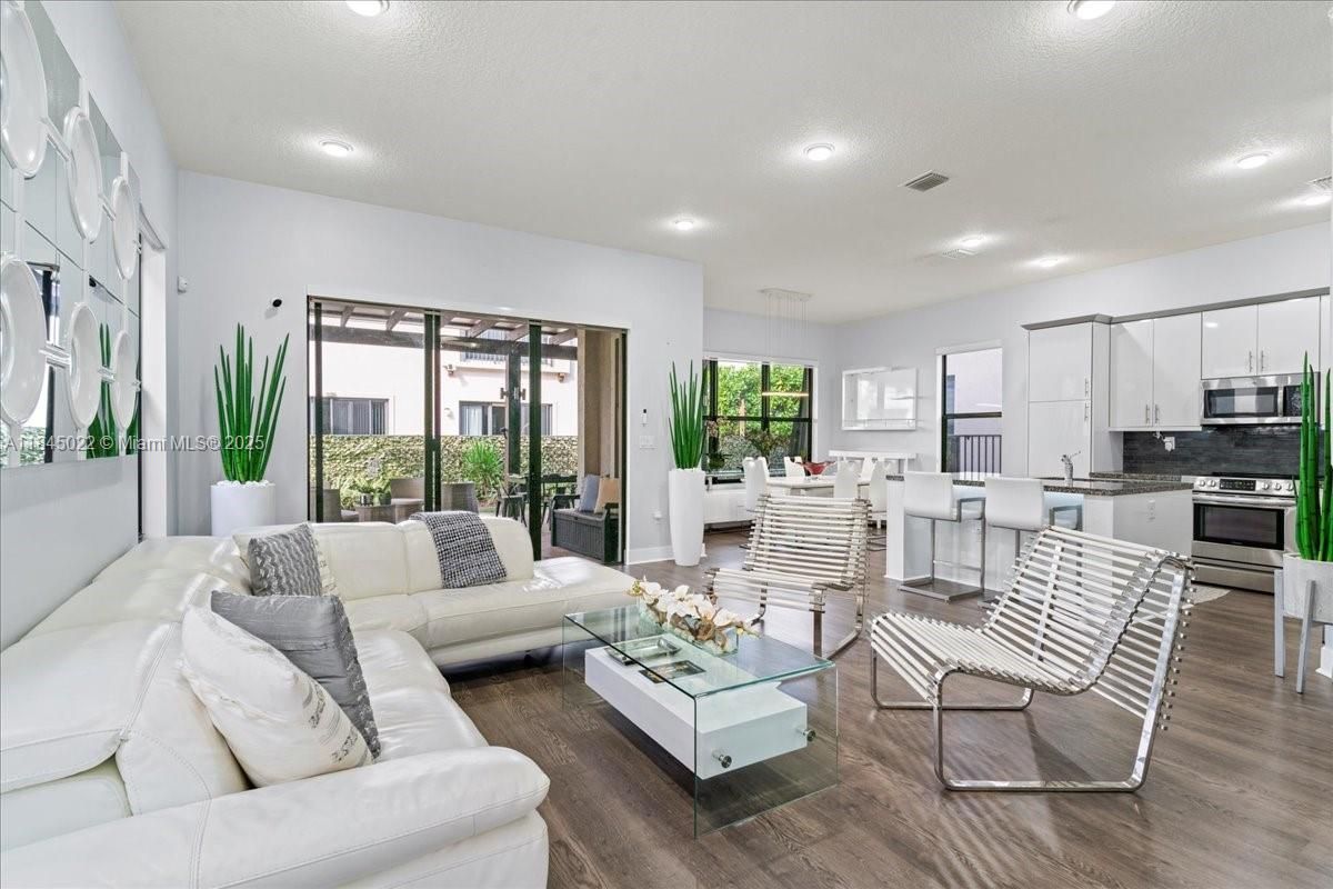Dining room, Interior, Kitchen, Living room, Pendant Lights, Recessed Lighting, Stainless Steel Appliances, Wood Texture Flooring
