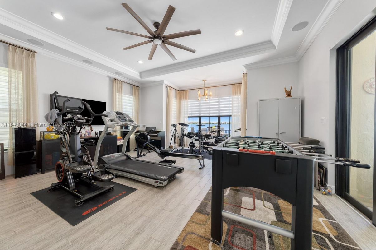 Chandelier, Fitness Equipment, Gym, Interior, Recessed Lighting, Wood Texture Flooring
